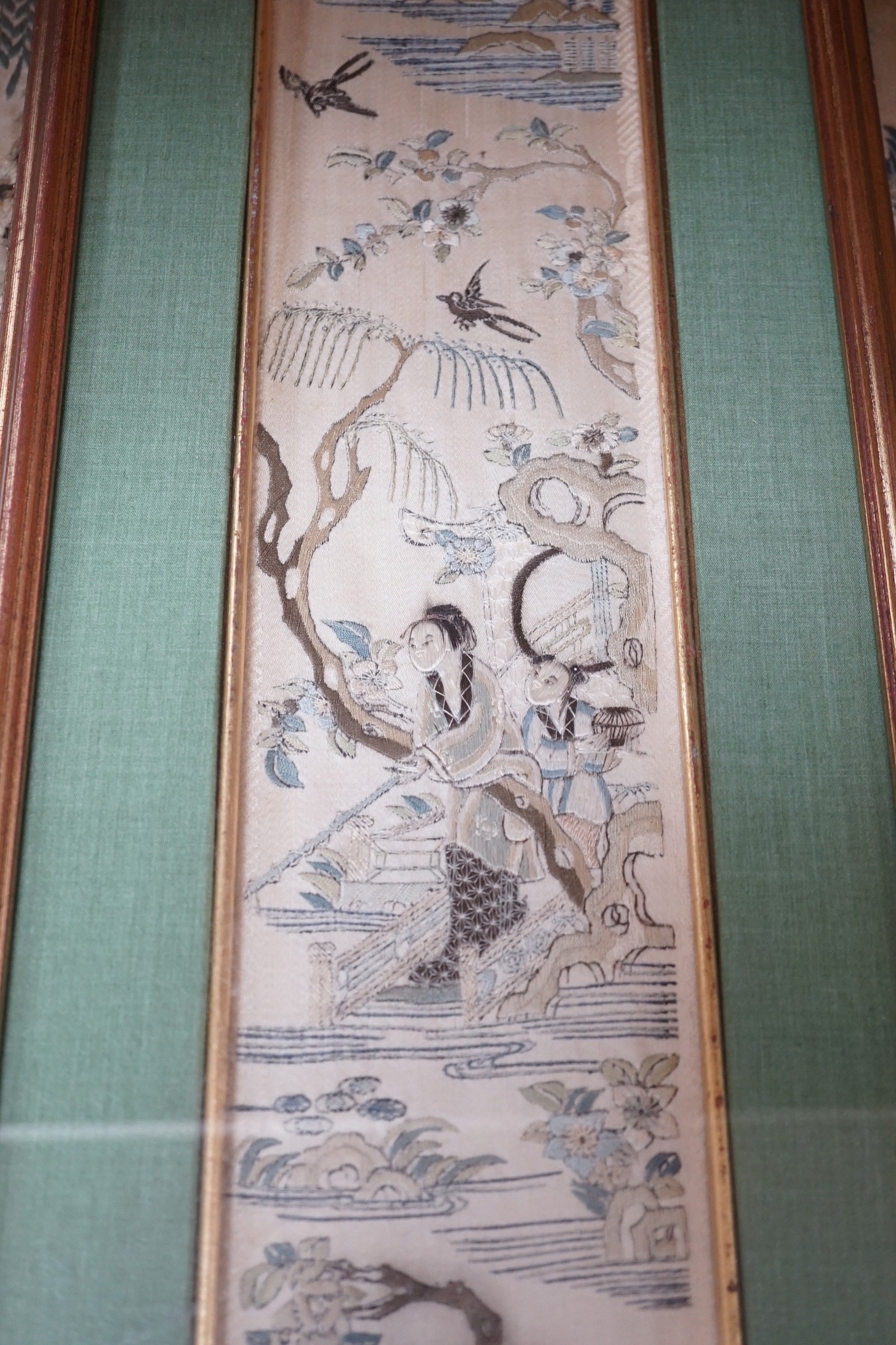 Three pairs of gilt framed, 19th century, silk embroidered, sleeve bands (for Chinese robes), 49cms long x 9cms wide (not including mount or frame)